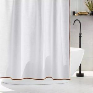Slightly used CB2 shower curtain with supporting shower rings.
